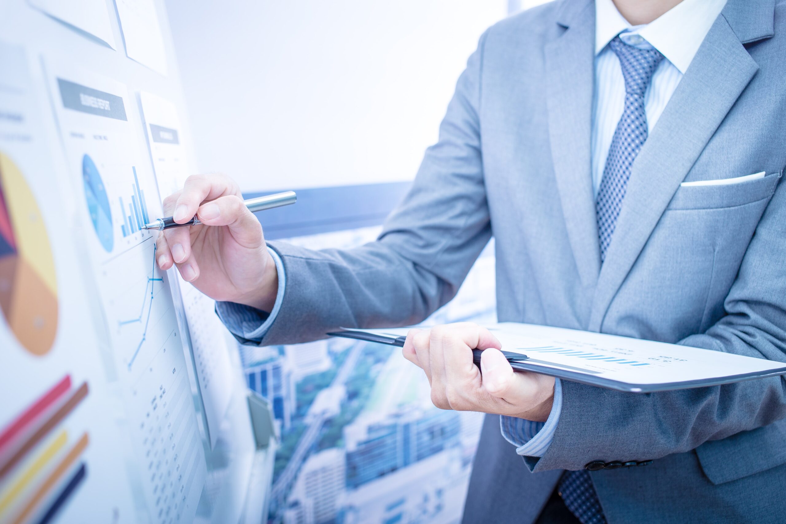 hand pointing at a chart